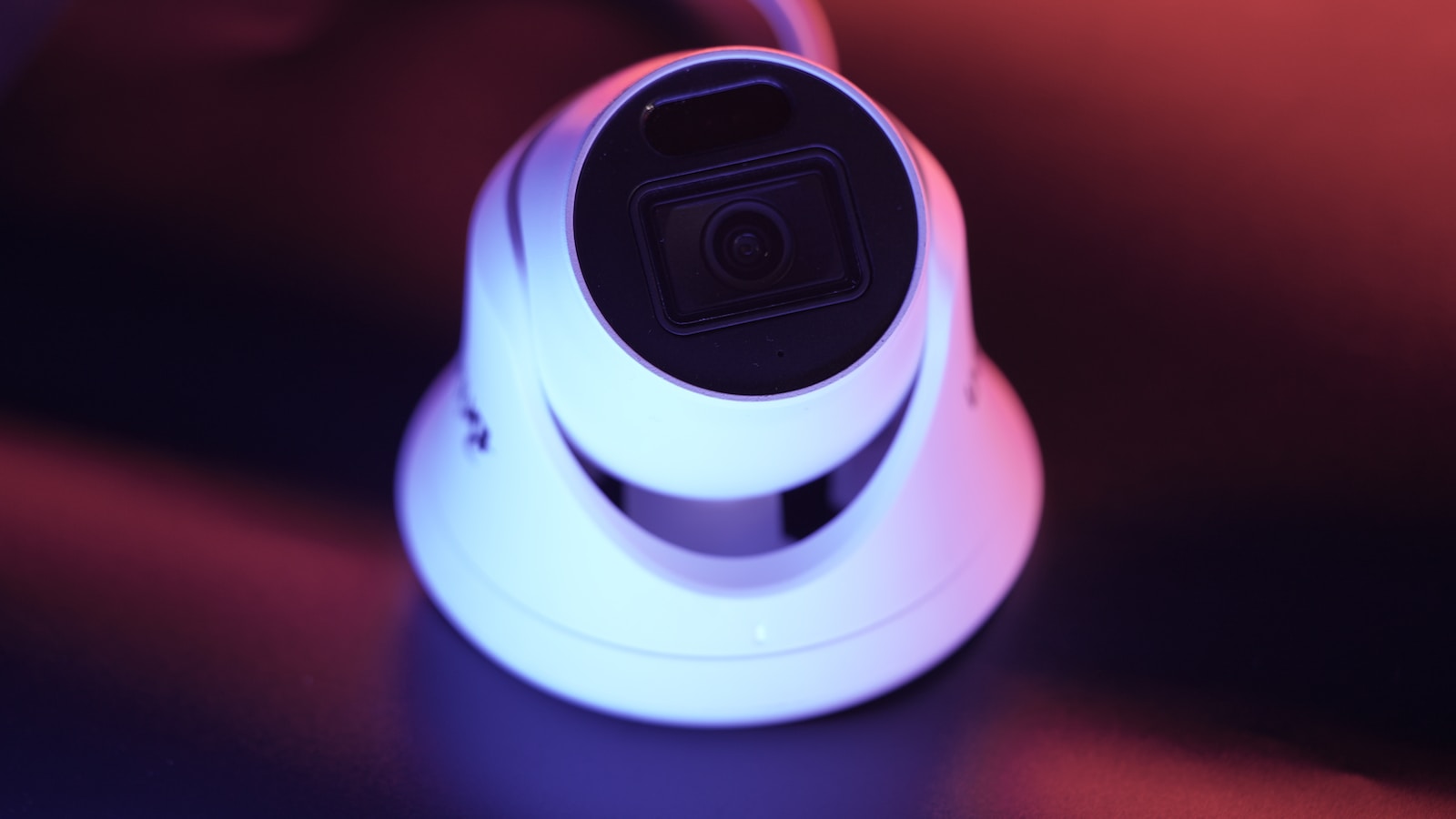 a white camera sitting on top of a table